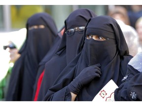 Egyptian women wearing the niqab in Egypt on Dec. 22, 2012.
(Egyptian women wearing "Niqab" line up outside a polling station to vote in the second round of a referendum on a disputed constitution drafted by Islamist supporters of President Mohammed Morsi in Giza, Egypt, Saturday, Dec. 22, 2012.