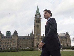 Prime minister designate Justin Trudeau walks to a news conference from Parliament Hill in Ottawa on Oct. 20, 2015. Prime minister-designate Justin Trudeau will announce soon whether he and his family will delay their move into 24 Sussex Drive, a residence that is in pressing need of major renovations.