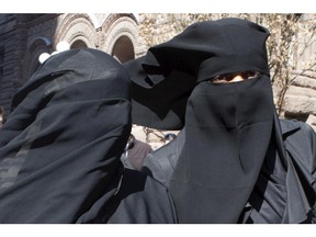 Women wear niqabs in Toronto in 2013.