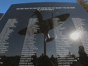 Essex Memorial Spitfire Committee chairwoman Suzanne Allison says more names of local Second World War air force veterans are being taken to add to the Honour Wall beneath the Spitfire Monument. The Spitfire is shown reflected in the honour wall on Tuesday, October 20, 2015, in Essex, Ont.
