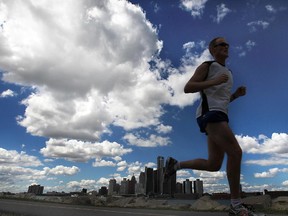 A runner takes advantage of a picture perfect day along the downtown waterfront in Windsor.
