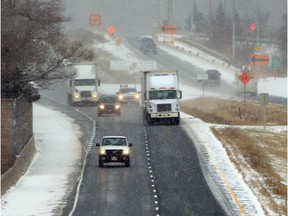 Traffic proceeds on E.C. Row in Windsor during a snow squall.