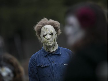 A guest dressed up as Michael Myers attends the wedding of Kasandra Kehoe and Craig Price (not pictured) who were married at  Windsor Grove Cemetery, Saturday, Oct. 31, 2015.