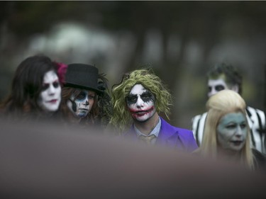 Wedding guests of bride and groom, Kasandra Kehoe and Craig Price (not pictured) dress up in scary Halloween costumes for their wedding at  Windsor Grove Cemetery, Saturday, Oct. 31, 2015.