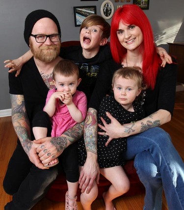 Jesse Eldredge and Colleen Bryant pose with their children Murphy Eldredge, 7, Ollie Eldredge, 4 and Daisy Eldredge, 2, at their Windsor, ON. home. Both parents are heavily tattooed and have had a wide range of feedback on their inked style.