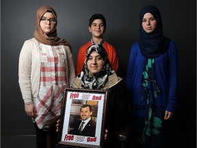 Nur Alaradir, Aliya Zaghuwan (mom), Mohammed Alaradi and Marwa Alaradi (left to right) are photographed at the Windsor Star in Windsor on Wednesday, June 3, 2015.