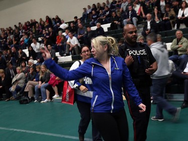 A parent reacts to the decision to close Harrow District High School during a special Greater Essex County District School Board meeting at the St. Clair College SportsPlex in Windsor on Tuesday, Oct. 13, 2015.