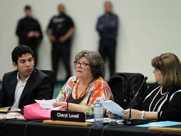 Julia Burgess (centre) asks a question during a special Greater Essex County District School Board meeting at the St. Clair College SportsPlex in Windsor on Tuesday, October 13, 2015. The closure of Harrow District High School and Western Secondary School was the topic of the special meeting.