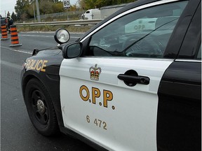 WINDSOR, ON.: OCTOBER 14, 2014 --    Police and tow truck crews work to clear a four vehicle accident from EC Row at Matchette Road in Windsor on Monday, October 14, 2014. The incident closed the west bound lanes for a couple hours and sent two people including a child to hospital with non life threatening injuries.                  (TYLER BROWNBRIDGE/The Windsor Star)