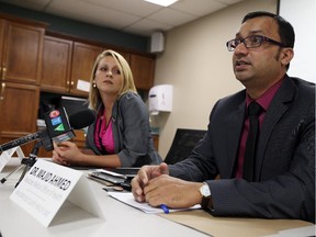 Erika Vitale and Dr. Wajid Ahmed (right) urge residence to get to their annual flu shot during a press conference at the The Windsor-Essex County Health Unit in Windsor on Thursday, October 15, 2015.