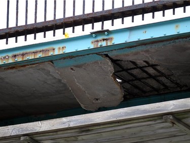 Inspectors from Transport Canada are joined by firefighters, city officials and engineers from the Ambassador Bridge as they inspect the underside of the 85-year-old bridge in Windsor on Thursday, October 15, 2015. Falling concrete forced the closure of the roads beneath the bridge.