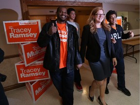 NDP candidate Tracey Ramsey and her family husband Germaine and their sons Maxwell (back) and Maliq (right) are greeted by supporters after defeated incumbent Jeff Watson in Essex on Monday, October 19, 2015.