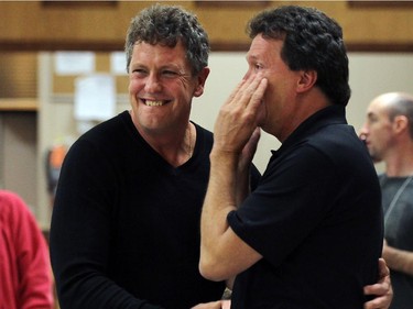 Tracey Ramsey supporters Roland Kiehne and Chris Taylor (right) celebrate after it was announced she defeated incumbent Jeff Watson in Essex on Monday, October 19, 2015.