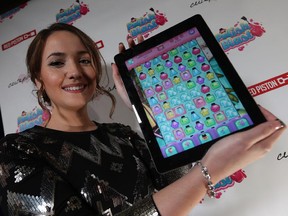 Sandi Ball, better known to her followers as Cutepolish, shows off her new game at a launch party at Level 3 in Windsor on Friday, October 23, 2015. The nail polish expert has over 18 million followers on her various social media platforms. The game is available for free download now.