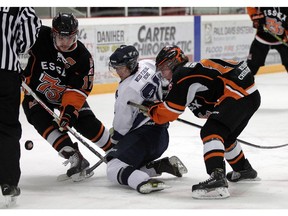 Wheatley Sharks Cole Butler (centre) is seen in action battling for the puck with against the Essex 73's.