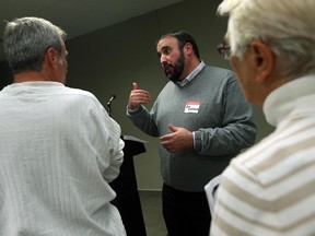 Ward 3 Councillor Rino Bortolin answers questions and meets with Ward 3 residence during a ward meeting at 400 City Hall Square in Windsor in this October 2015 file photo.