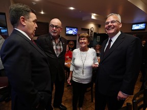 Dwight Duncan, Gary McNamara, Doreen Ouellette and Frank Schiller (left to right) attend a Liberal fundraiser at Riviera Pizza in Windsor on Thursday, October 8, 2015.