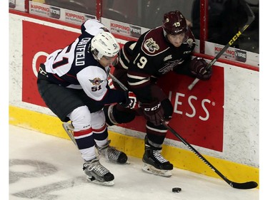 The Windsor Spitfires Jalen Chatfield chechs the Peterborough Petes Josh Maquire at the WFCU Centre in Windsor on Thursday, October 8, 2015.                                      (TYLER BROWNBRIDGE/The Windsor Star)