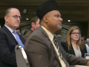 From left, Mayor Drew Dilkens, Dr. Syed Muhammad Aslam Daud, and MP elect for Essex, Tracey Ramsey, attend the Ahmadiyya Muslim Jamaat at the Caboto Club, Sunday, Oct. 25, 2015.