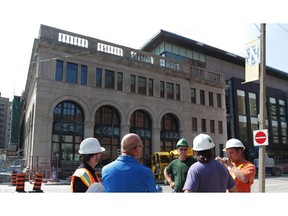 WINDSOR, Ontario. August 19, 2015 -  Nearing completion, supervisors have a discussion outside University of Windsor's new School of Social Work and Centre for Executive and Professional Education at Pitt and Ferry Streets August 19, 2015.  Some university employees were moving into the facility Wednesday. (NICK BRANCACCIO/The Windsor Star)