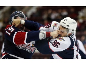 WINDSOR, ONTARIO - OCT.1.2015 -Saginaw Spirit winger Connor Brown fights Windsor Spitfires Cristiano DiGiacinto during third period Ontario Hockey League action at the WFCU Centre on October 1, 2015. (JASON KRYK/The Windsor Star)