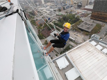 Windsor Star reporter Kelly Steele rappels down the Caesars Windsor Augustus Tower during the 3rd annual Easter Seals Drop Zone in Windsor, Ontario.
