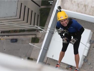 Windsor Star reporter Kelly Steele rappels down the Caesars Windsor Augustus Tower during the 3rd annual Easter Seals Drop Zone in Windsor, Ontario.