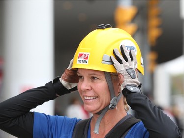 Windsor Star reporter Kelly Steele rappels down the Caesars Windsor Augustus Tower during the 3rd annual Easter Seals Drop Zone in Windsor, Ontario.