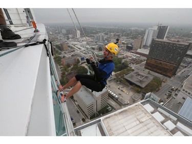 Windsor Star reporter Kelly Steele rappels down the Caesars Windsor Augustus Tower during the 3rd annual Easter Seals Drop Zone in Windsor, Ontario.     (JASON KRYK/The Windsor Star)