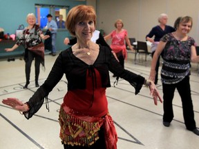 Deanna Hallett, a belly dancer and instructor, leads a group of seniors at Life After Fifty seniors centre, Oct. 1, 2015.
