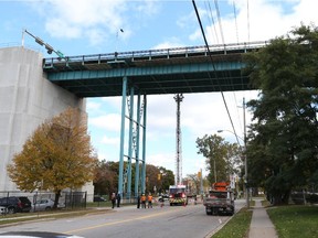 Windsor Fire Service assists a consultant engineer during a close inspection of the Ambassador Bridge near Huron Church road in Windsor, Ontario on October 14, 2015.