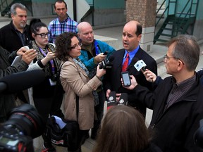 Windsor, Ontario. October 15, 2015 - Matthew Moroun, centre, Ambassador Bridge vice chairman and son of bridge owner Matty Moroun, speaks to media during press conference dealing with issue of bridge safety and the closure of several Windsor streets October 15, 2015.  (NICK BRANCACCIO/The Windsor Star)