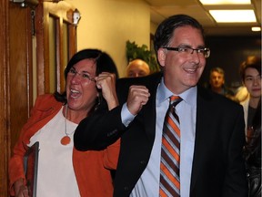 Brian Masse and Cheryl Hardcastle celebrate their victories at the Teutonia Club in Windsor, Ont., on Monday, Oct. 19, 2015.
