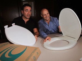 Centoco Plastics Ltd. executives Saverio Paonessa, left, and Pat Soulliere with toilet seats sold under the retail brand of Peter Anthony, October 2 , 2015.