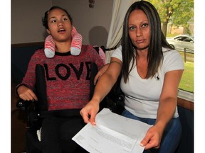 Windsor, Ontario. October 2, 2015 - Teresa Commisso, right, is outraged over a letter from Holy Names High School which states her daughter's lunch will not be heated up because of "Work To Rule" order by the union, October 2 , 2015. Commisso's daughter Tayla Rock, left, has severe cerebral palsy. (NICK BRANCACCIO/The Windsor Star)