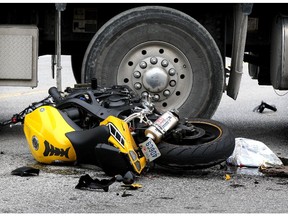 A Yamaha motorcycle is crumpled and leaking fluids following a collision with a  dump truck on Tecumseh Road East and Shawnee Road Friday Oct. 2, 2015. The rider of the motorcycle was taken to Windsor Regional Hospital Ouellette Avenue campus with multiple fractures and internal injuries.