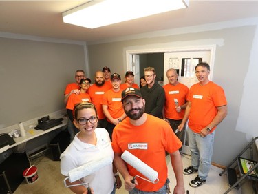 WINDSOR, ONTARIO - OCTOBER 5, 2015 - Tiffany Owen , outreach worker with  Windsor Residence for Young Men,  and    Mark Belanger, store manager of Home Depot  at Walker and Division,  along with volunteers, paint  the Windsor Residence for Young Men during.   Home Depot and a team of volunteers  are spending two days painting the residence and enhancing the interior of the home. (JASON KRYK/The Windsor Star)