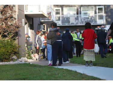 Emotions ran high as residents and family members reunited on the scene of an early morning apartment fire at 2455 Rivard in Windsor, Ontario on October 7, 2015.   (JASON KRYK/The Windsor Star)