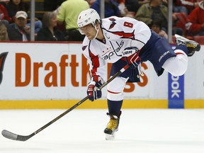 Washington Capitals left wing Alex Ovechkin shoots against the Detroit Red Wings in the first period Tuesday, Nov. 10, 2015 in Detroit. (AP Photo/Paul Sancya)