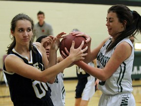 Lajeunesse's Taylor Whitehead, right, and UMEI Christian High School's Amy Unger fight for a loose ball during the high school basketball final at Lajeunesse in Windsor on Wednesday, November 11, 2015.                                               (TYLER BROWNBRIDGE/The Windsor Star)