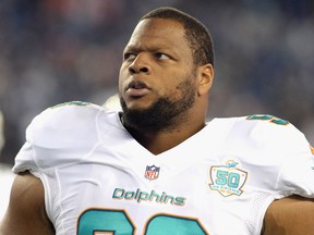 Ndomukong Suh #93 of the Miami Dolphins looks on before a game against the New England Patriots at Gillette Stadium on October 29, 2015 in Foxboro, Massachusetts.  (Photo by Darren McCollester/Getty Images)