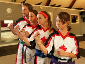 Steve Gombai, from left, with his daughters Trista, Nathasha and Lilly are competing at the the world karate championships in Orlando. (JASON KRYK/WINDSOR STAR)