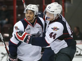 Windsor Spitfires Jalen Chatfield and Mike Kirwan celebrate a third period goal during the Ontario Hockey League game against the Saginaw Spirit at the WFCU Centre on October 1, 2015. (JASON KRYK/The Windsor Star)