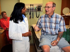 Leo Robert, right, chats with Dr. Sindu Kanjeekal in a Cancer Centre examination room at Windsor Regional Hospital in this September 2015 file photo. Leo died on Nov. 8.