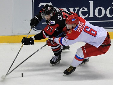 Michael Dal Collle, left, of Team OHL battles Egor Rykov of Team Russia in the first period at Windsor Family Credit Union Centre Monday November 16, 2015.  The game was part of 2015 CHL Canada Russia Series.