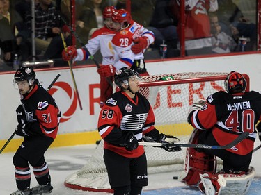 Aaron Luchuk, left, Mitchell Vande Sompel and goaltender Michael McNiven of Team OHL react as Team Russia celebrate the game's first goal scored by Kirill Pilipenko at Windsor Family Credit Union Centre Monday November 16, 2015. The game was part of 2015 CHL Canada Russia Series.