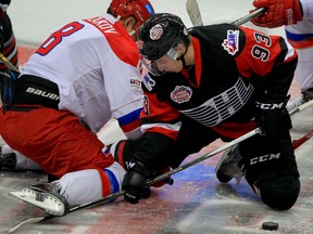 Maple Leafs draft pick Mitchell Marner, right, of Team OHL and Andrey Svetlakov, left, of Team Russia battle for the opening faceoff at Windsor Family Credit Union Centre Monday November 16, 2015. (NICK BRANCACCIO/Windsor Star)