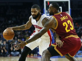 Detroit Pistons’ Marcus Morris (13) drives against Cleveland Cavaliers' LeBron James (23) during the first half of an NBA basketball game, Tuesday, Nov. 17, 2015, in Auburn Hills, Mich. (AP Photo/Duane Burleson)
