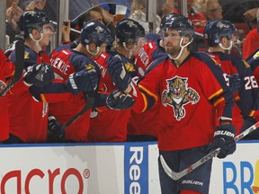 Belle River's Aaron Ekblad, right, of the Florida Panthers is congratulated by teammates after scoring a second period goal against the Calgary Flames at the BB&T Center on November 10, 2015 in Sunrise, Florida. (Photo by Joel Auerbach/Getty Images)