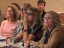 Closing the Wage Gap town hall guests Silvia Nadeau, left, Terry Weymouth, Theresa Farao and Jodi Nesbitt listen to a presentation by gender wage gap steering committee, Ministry of Labour at Holiday Inn on Huron Church November 19, 2015.